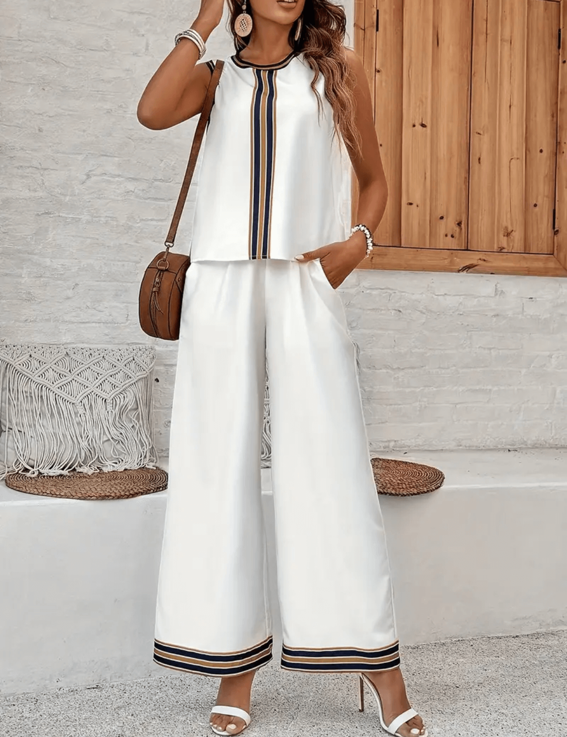 Conjunto feminino com regata minimalista e calça wide leg cintura alta com bolsos. Look elegante e fresco para trabalho ou eventos.
